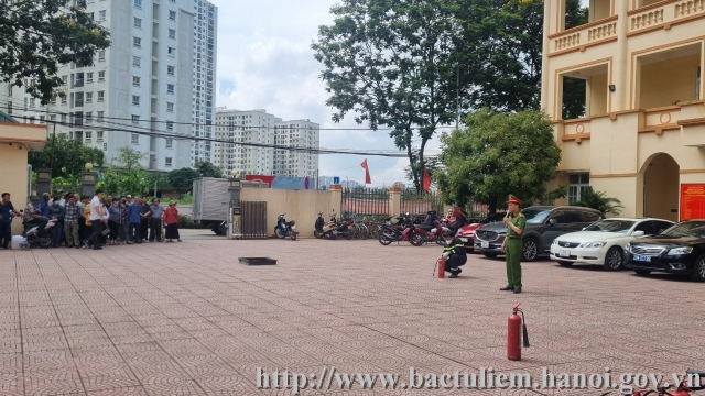 A picture containing outdoor, building, ground, treeDescription automatically generated